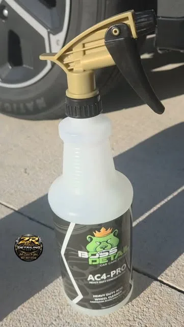 Professional detailing chemical in a gold-trigger spray bottle